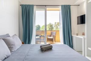 Postel nebo postele na pokoji v ubytování crabonaxa suites