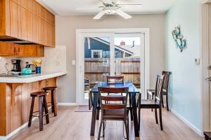 a kitchen and dining room with a table and chairs at Verdon Oasis in Morro Bay