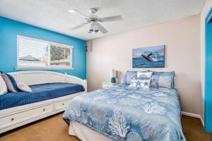 a bedroom with a bed and a ceiling fan at Verdon Oasis in Morro Bay