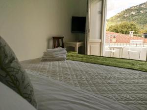 Postel nebo postele na pokoji v ubytování B&B Limone + 19 fotografií