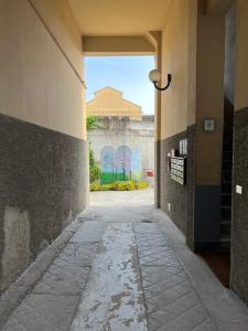 an empty hallway in a building with graffiti on the wall at Xenia Apartments - Nuovo appartamento in zona tranquilla in Milan