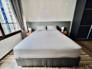 a bedroom with a large bed in a room at Modiano Luxury Apartment Thessaloniki in Thessaloniki