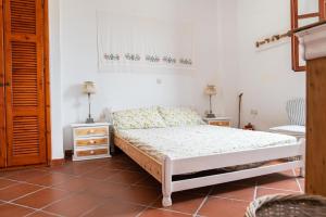 Katil atau katil-katil dalam bilik di Ficus Traditional Apartments