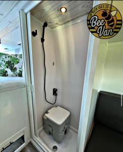 a small bathroom with a toilet in a trailer at BeeVan in Aguadilla