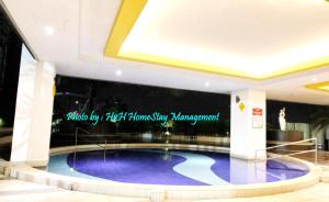a large swimming pool in the middle of a building at H2H - Cherry house Majestic in Ipoh