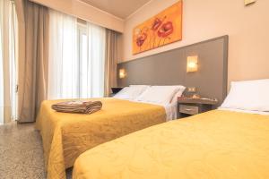 Postel nebo postele na pokoji v ubytování Hotel London + 37 fotografií