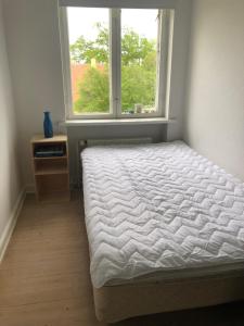 Postel nebo postele na pokoji v ubytování Sundkig fra 1. Sal