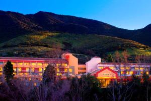a building with a mountain in the background at Sheraton Agoura Hills Hotel in Agoura Hills