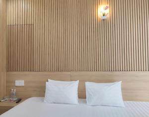 Postel nebo postele na pokoji v ubytování Thanh Hiền HB Hotel