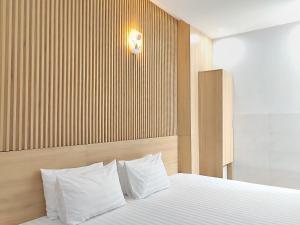 Postel nebo postele na pokoji v ubytování Thanh Hiền HB Hotel