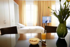 Postel nebo postele na pokoji v ubytování Residence Apartments by Hotel du Commerce