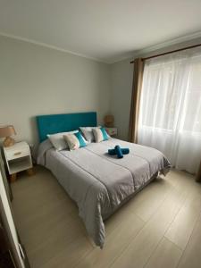 Una cama o camas en una habitación de Departamento en Pucón