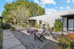 a patio with a table and benches and a grill at Unique Design 1-bedroom Apartment - 80 Walkscore! in Phoenix