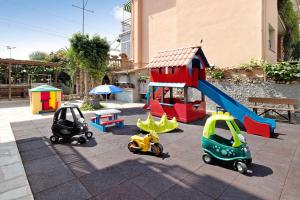 a playground with toy cars and a slide at Monolocale 9 in Borgio Verezzi