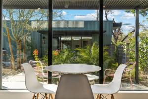 a table and chairs in a patio with a table at Unique Design 2-bedroom Apartment - 80 Walkscore! in Phoenix