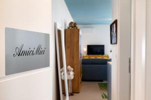a hallway with a living room with a blue couch at Amici Miei Makarska in Makarska +19 photos