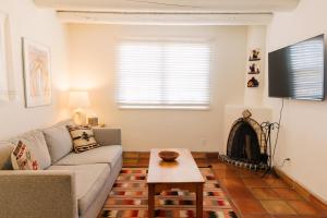 a living room with a couch and a fireplace at Pueblo Bonito Santa Fe in Santa Fe