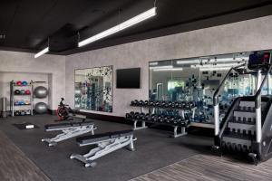a gym with a large glass wall with tread machines at Sheraton Reston in Reston