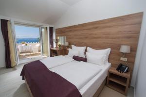 Postel nebo postele na pokoji v ubytování Hotel Biokovo