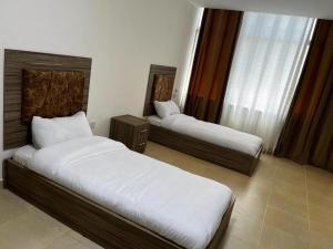 Krevet ili kreveti u jedinici u okviru objekta الريان للشقق الفندقية
