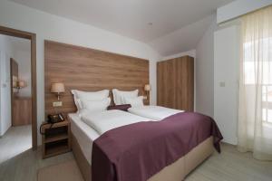 Postel nebo postele na pokoji v ubytování Hotel Biokovo