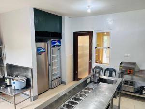 Cuina o zona de cuina de Camp Backpackers Port Barton
