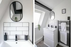 a bathroom with a sink and a mirror at Chester Stays - Beautiful loft apartment with parking in Chester +20 photos