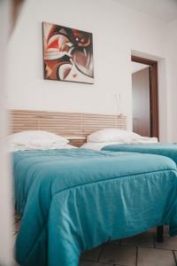 Кровать или кровати в номере Villa Gianna