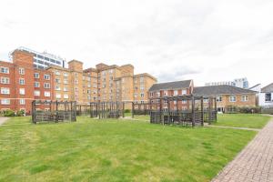 a park in front of a large brick building at Escape The Matrix - 2 Bed Flat in City Centre with Free Parking in Southampton