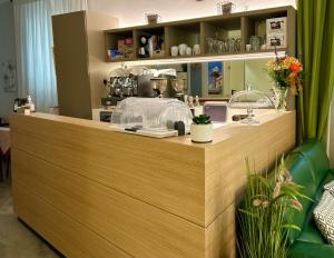 a wooden counter in a store with a counter top at Hotel Sanmicheli in Verona