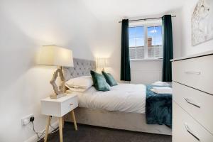 a bedroom with a bed and a window at Sleek Gem Home in Houghton le Spring, Sleeps 5 in Houghton le Spring