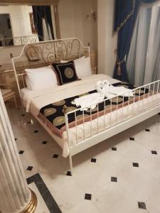 Posteľ alebo postele v izbe v ubytovaní Royal House