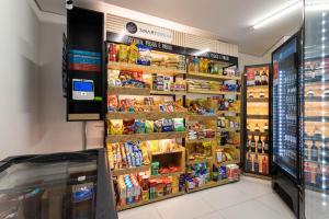 a grocery store aisle with food and other groceries at Parque Jockey by Viva - Prédio com fácil acesso a Pinheiros e ao Butantã in São Paulo