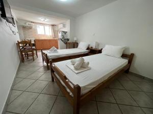 Posteľ alebo postele v izbe v ubytovaní Athina Rooms