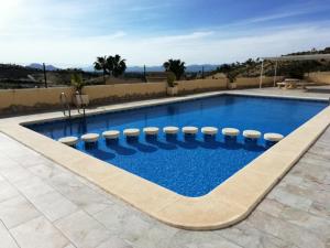 een zwembad in een villa bij Golf Club La Marquesa best view ,, Home Aqma ,, in Ciudad Quesada