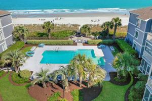 an aerial view of a resort with a swimming pool and a beach at The Sand Dollar at Sea Cloisters in Myrtle Beach