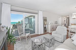 a living room with a view of the ocean at The Sand Dollar at Sea Cloisters in Myrtle Beach