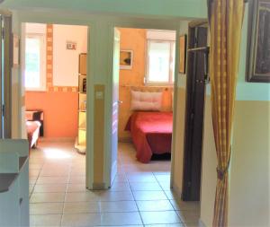 a view of a living room with a couch and a room at Gîte de La Petite Ferme in Criquetot-le-Mauconduit