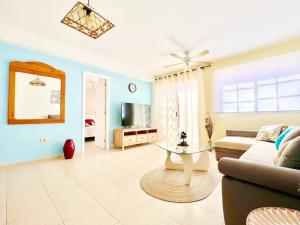 a living room with a couch and a table at !!! Relaxing View, The Heights Apartment With Terrace and Heated Pools, Los Cristianos in Los Cristianos
