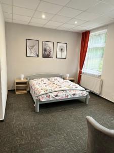 A bed or beds in a room at Penzión Michaela Vyhne