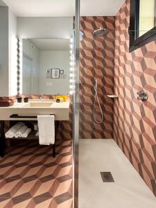 a bathroom with a shower and a sink at Hotel Orientale in Brindisi