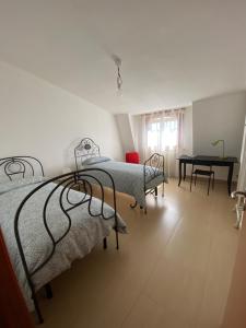 Posteľ alebo postele v izbe v ubytovaní Sunny Home:Palo del Colle
