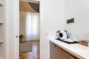 a kitchen with a counter with a appliance on it at 504 Corso Suites in Rome