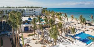 an aerial view of a resort with a pool and the beach at Riu Reggae - Adults Only - All Inclusive in Montego Bay