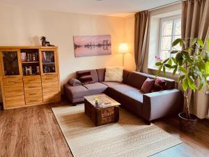 a living room with a couch and a table at Alte Schmiede zu Trarbach in Traben-Trarbach