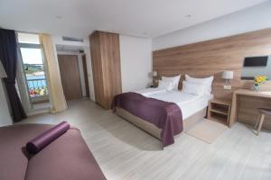 Postel nebo postele na pokoji v ubytování Hotel Biokovo
