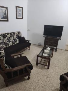 TV a/nebo společenská místnost v ubytování San Gregorio House