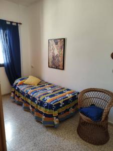 Postel nebo postele na pokoji v ubytování San Gregorio House + 2 fotografie