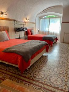 En eller flere senge i et værelse på Mas des TRAVES Anduze avec piscine + 28 billeder