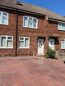 a brick house with white doors and windows at 1 bedroom flat sleeps 4 in Abingdon Oxfordshire in Abingdon +11 photos